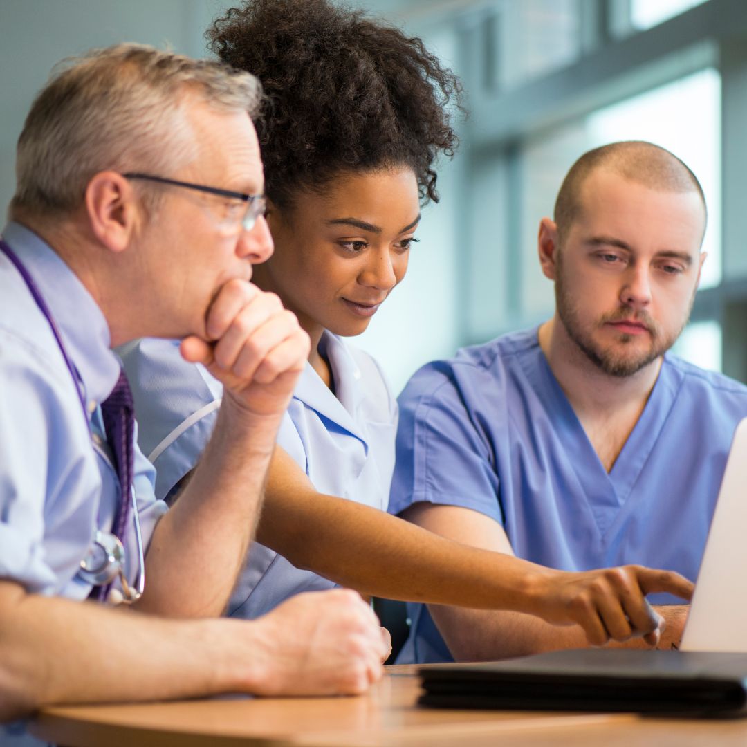 A team of medical staff exploring training options online